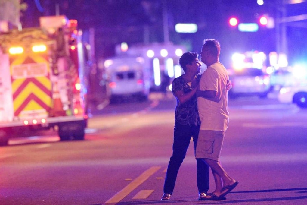 Family members wait for word from the police near the Pulse nightclub in Orlando, Florida, on the night of June 12. Photo: AP