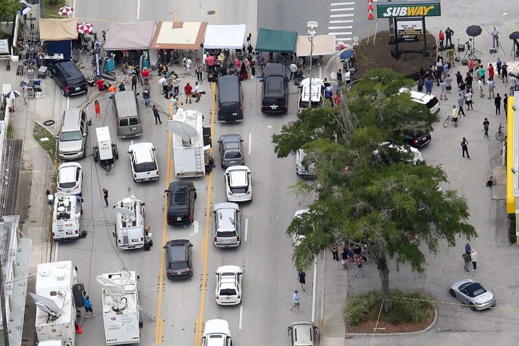 The media ’camp’ on Orange Avenue, just north of the Pulse nightclub in Orlando, where gunman Omar Mateen opened fire, killing 49 people. Photo: AP