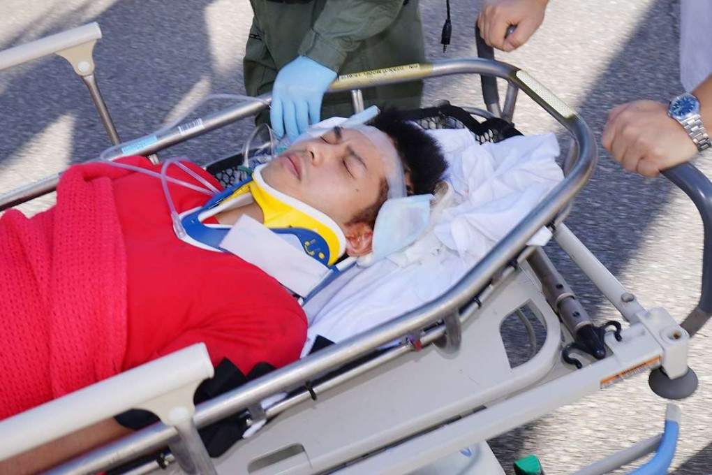 The injured hiker is taken to Tuen Mun Hospital for treatment. Photo: SCMP Pictures