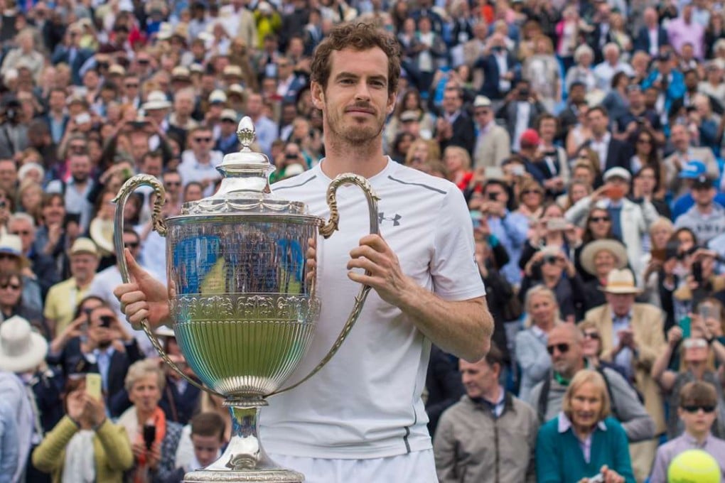 Andy Murray of Britain holds the trophy after his final victory against Milos Raonic of Canada during the Aegon Championships at Queen's Club in London. Photo: Xinhua