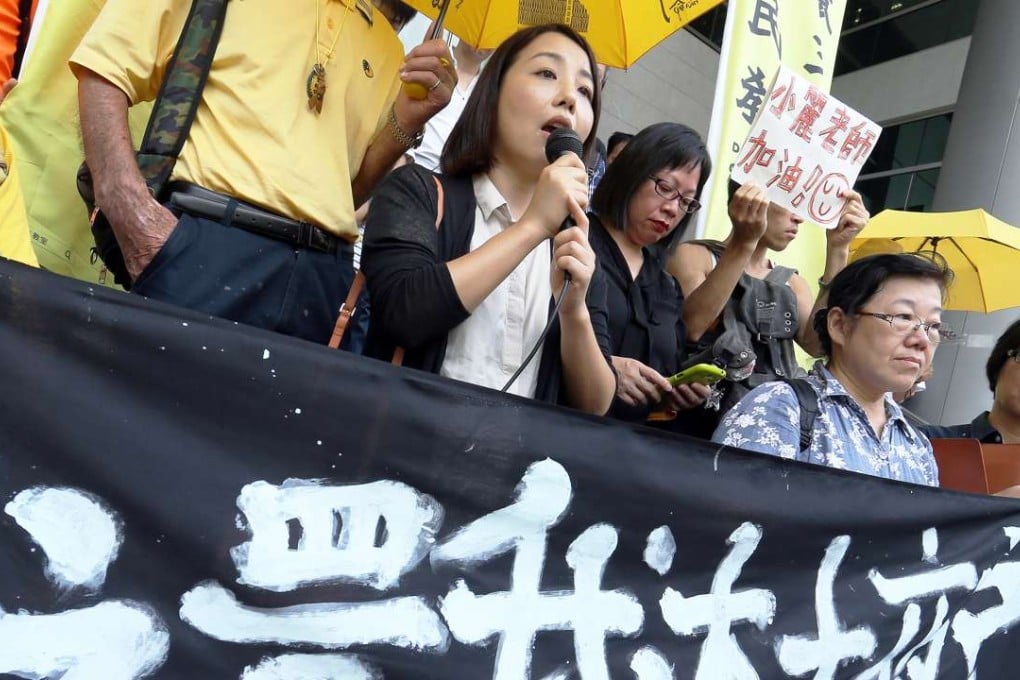 Outside court, lecturer Lau Siu-lai (holding microphone) urged the government to rethink its policies on hawking. Photo: Dickson Lee