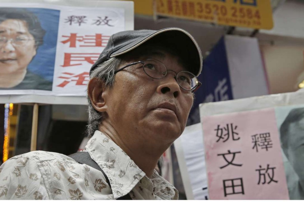 Lam Wing-kee led a procession of more than a thousand people in Hong Kong after he told his story of being held on the mainland, but his former girlfriend said he was “not like a man”. Photo: AP