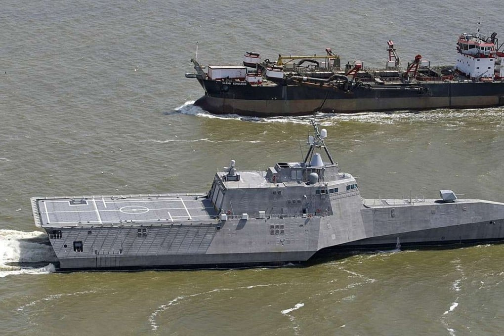 In this March 24, 2010, file photo, the littoral combat ship USS Independence, foreground, passes another vessel as it makes its way south through the waters of Mobile Bay, Alabama. The Navy spent hundreds of millions on speedy warships like the Independence, only to question whether they would be able to survive battle with a heavily armed enemy. Photo: AP