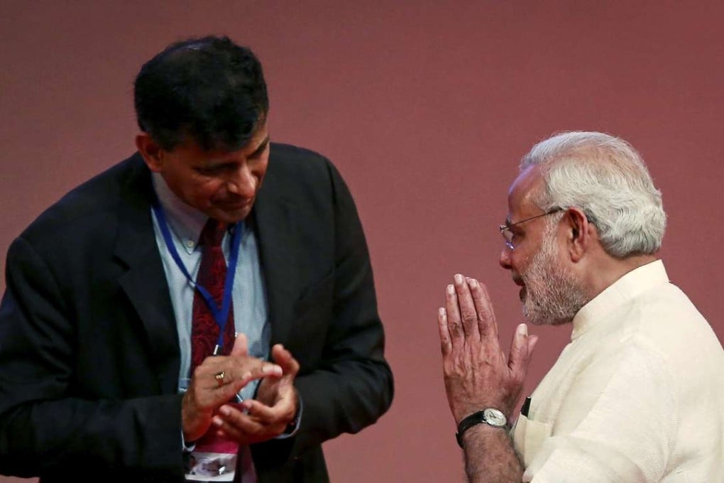 India's Prime Minister Narendra Modi gestures to Reserve Bank of India Governor Raghuram Rajan. Photo: Reuters