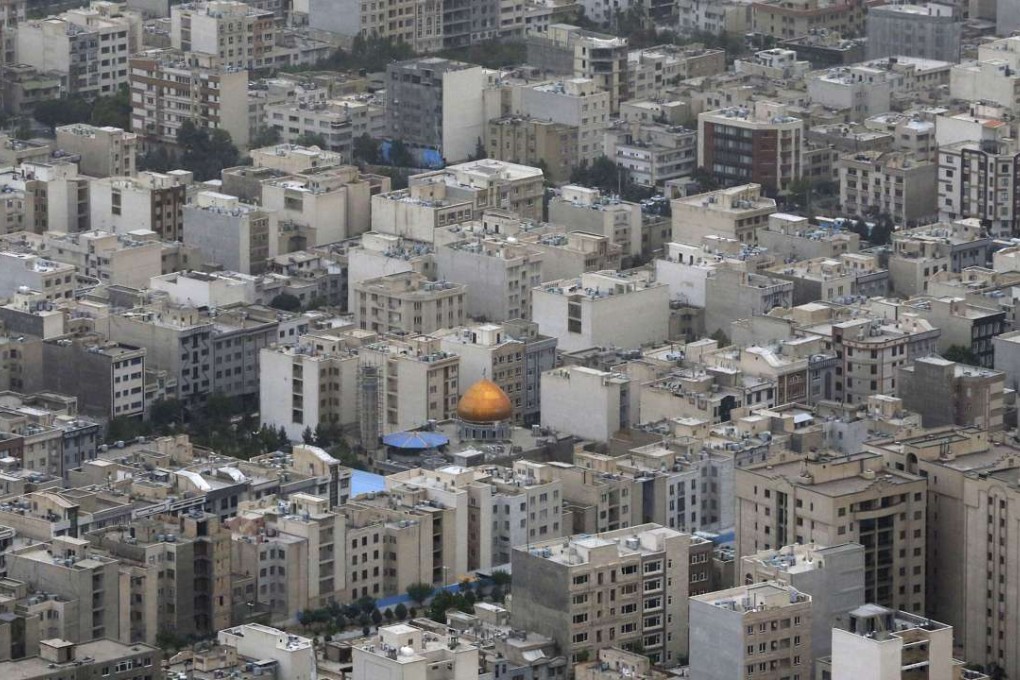 A mosque is surrounded by residential buildings in Tehran on June 6. Photo: AP
