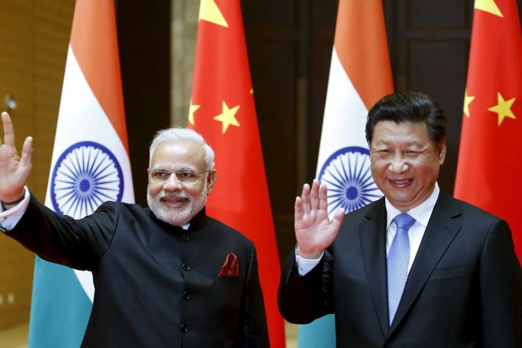 Indian Prime Minister Narendra Modi and President Xi Jinping wave before a meeting in Xian, Shaanxi province, in May 2015. Photo: Reuters