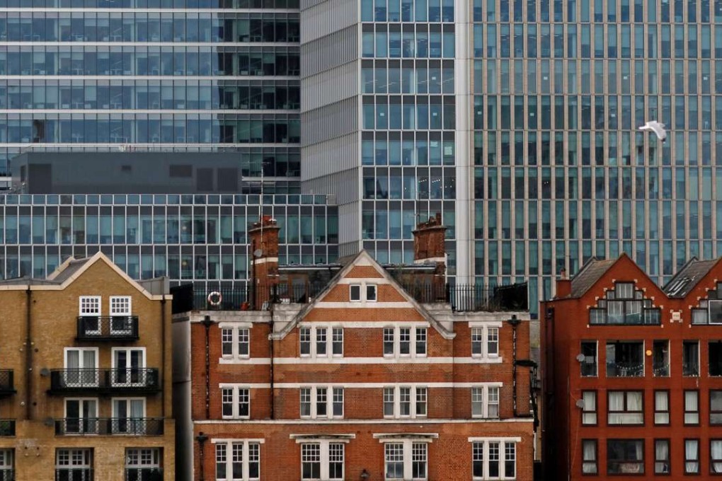Apartment buildings backdropped by skyscrapers at Canary Wharf in London. Experts suggest top-end property in the UK capital will still be in hot demand, regardless of which way the Brexit vote goes on Thursday. Photo: Reinhard Krause, Reuters
