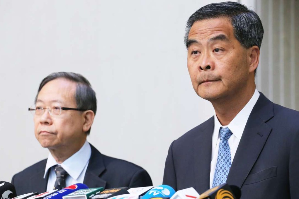 Hong Kong Chief Executive Leung Chun-ying, with security minister Lai Tung-kwok, at Tamar on Monday. Photo: Felix Wong
