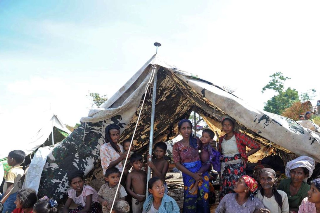 Muslim Rohingya people wait for the arrival in a camp for displaced people in Rakhine state in 2012. Photo: AFP