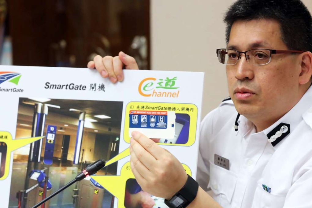 Raymond Lok Wai-man of the Immigration Department explaining the new arrangements in Wan Chai. Photo: Edward Wong