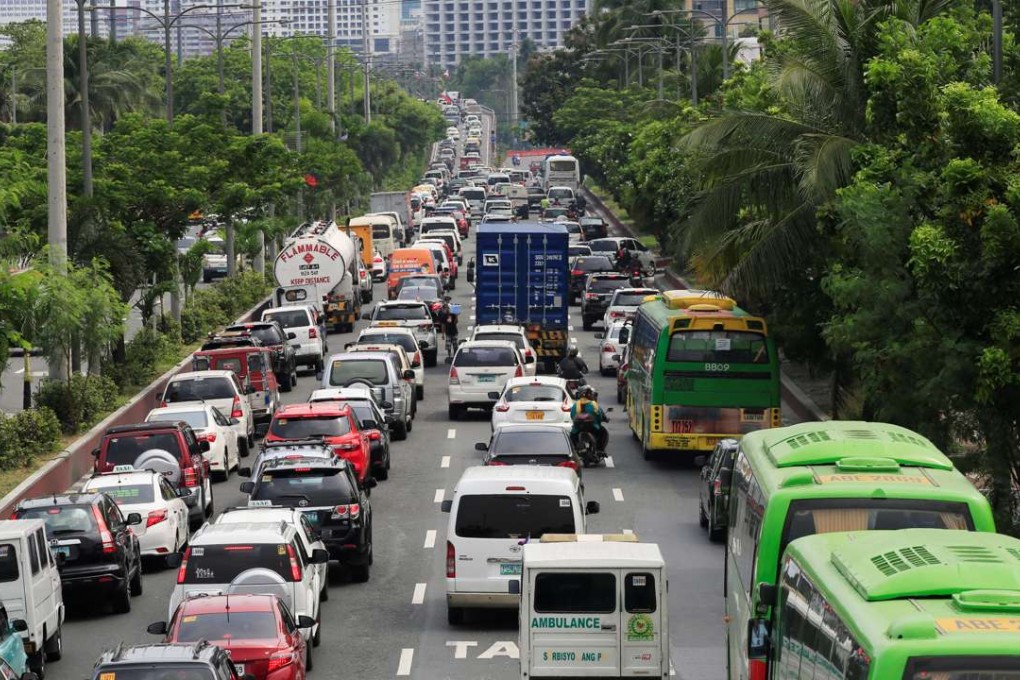 Motorists stuck in traffic jams along Roxas boulevard in Manila. Photo: Reuters