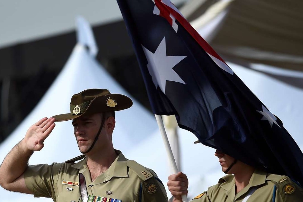Australian Military personnel pay their last respects during a repatriation ceremony. Photo: AFP