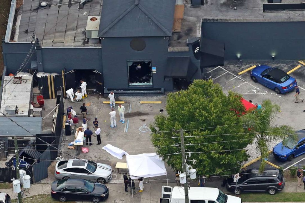 Police and forensics experts comb the exterior of Orlando’s Pulse nightclub on June 12, hours after the end of the massacre at the club that ended with the deaths of 49 patrons and gunman Omar Mateen. Photo: AP