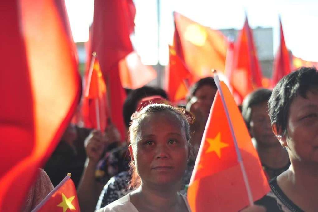 Villagers rally in Wukan late Monday afternoon. Authorities have detained local Communist Party secretary Lin Zuluan on suspicion of taking bribes in relation to infrastructure projects. Photo: SCMP Pictures
