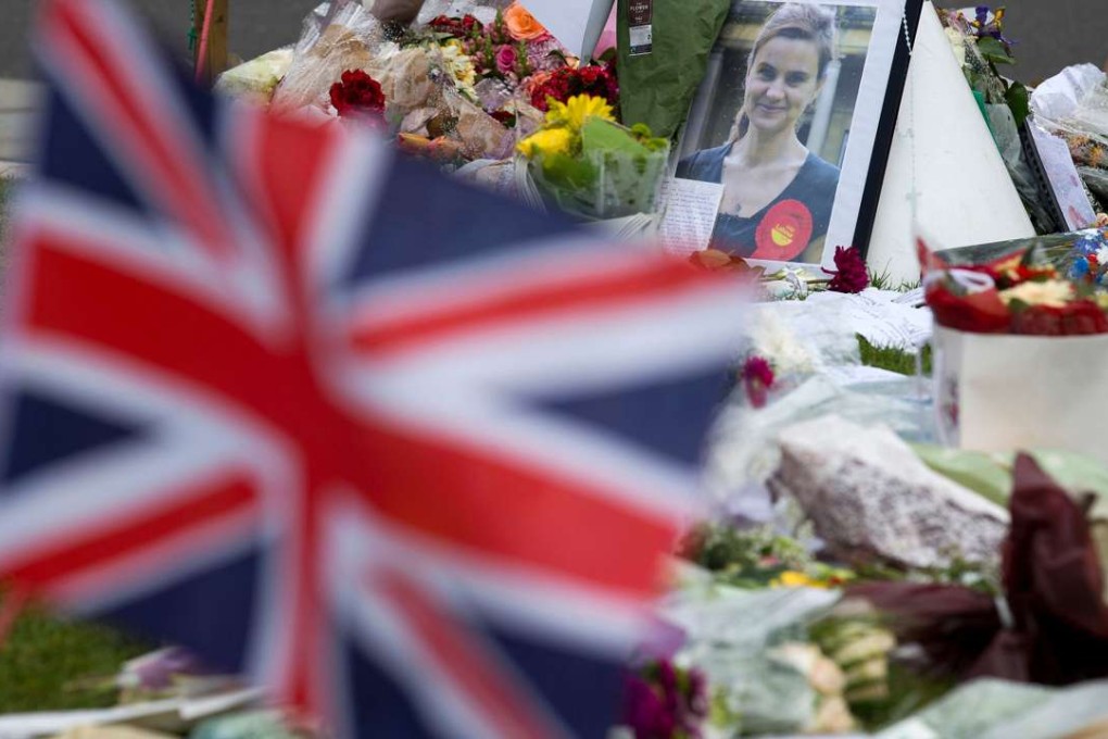 A memorial to murdered Labour MP Jo Cox outside the Houses of Parliament in London. The tragic murder of Cox, a supporter of Britain’s membership of the EU, seems to have stopped the momentum that the Leave campaign was gathering. Photo: AFP