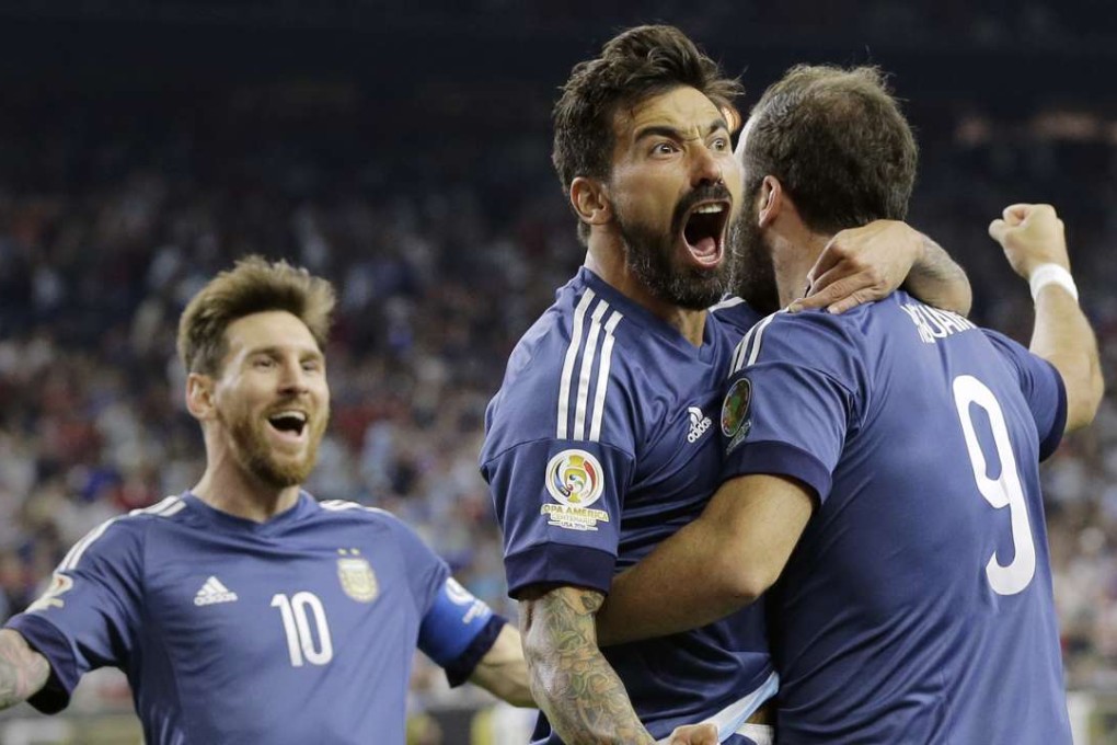 Argentina's Gonzalo Higuain celebrates his goal against the United States with Lionel Messi and Ezequiel Lavezzi. Photo: AP