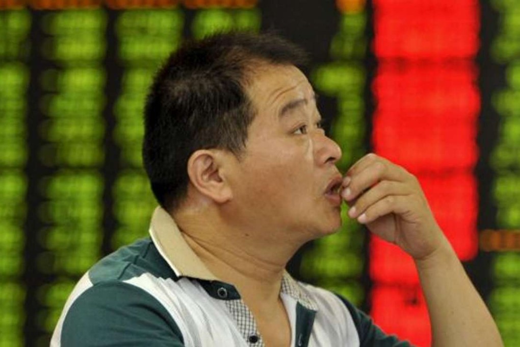 A file picture of a retail investor in Fuyang in Anhui province monitoring stock prices. Photo: Reuters