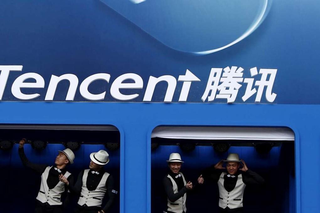 Entertainers perform underneath a Tencent logo at the Global Mobile Internet Conference in Beijing in 2014. Photo: Kim Kyung-Hoon, Reuters
