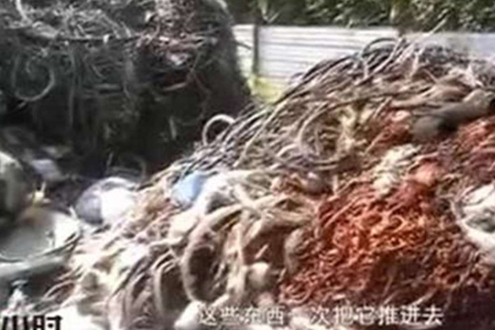 A screenshot from the CCTV programme that scrap rubber tyres are being used as raw materials for making synthetic school running tracks on the mainland. Photo: SCMP Pictures
