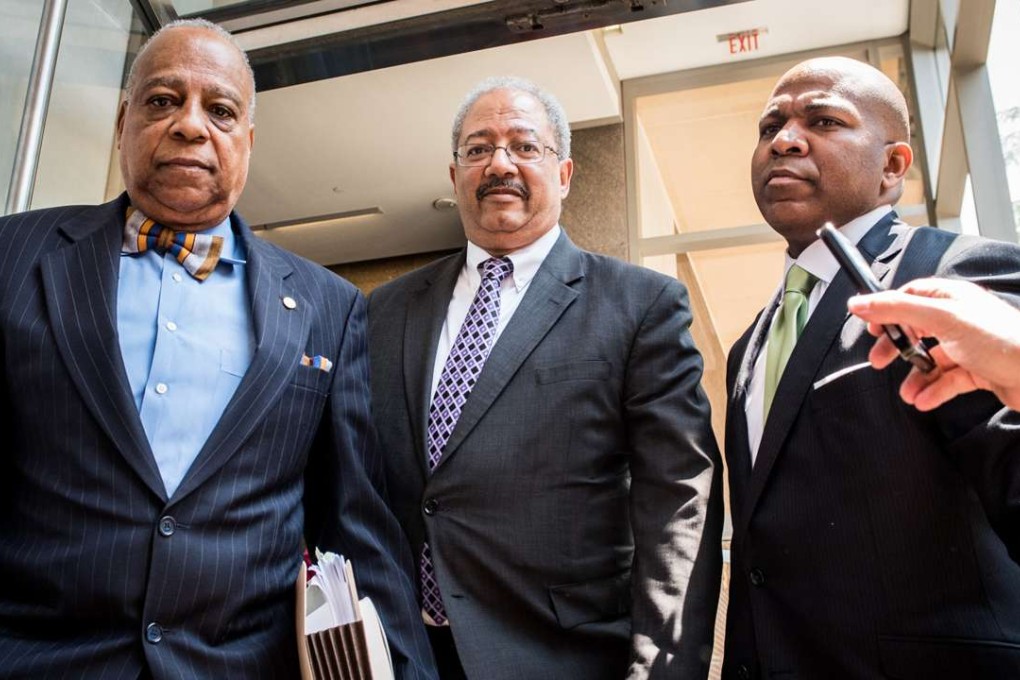 US Representative Chaka Fattah (centre) leaves a federal courthouse after being convicted on Tuesday in a federal racketeering case in Philadelphia. Photo: TNS