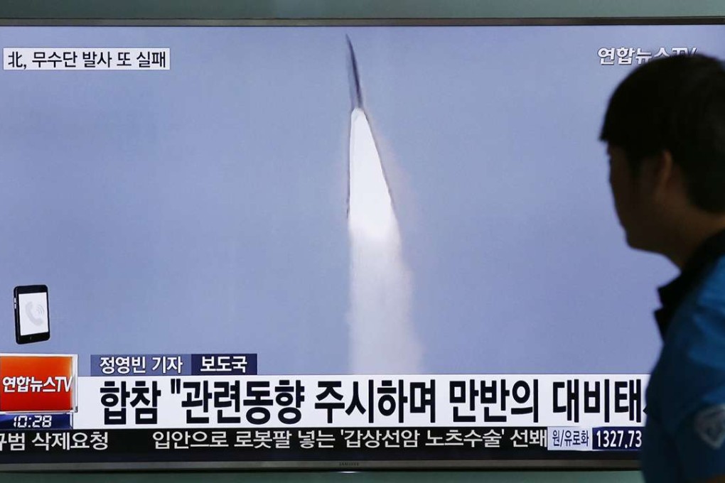 In this May 31 file photo, a man watches a TV news program reporting about a missile launch of North Korea, at a train station in Seoul, South Korea. In a remarkable show of persistence, North Korea on Wednesday fired two suspected Musudan mid-range missiles. Photo: AP