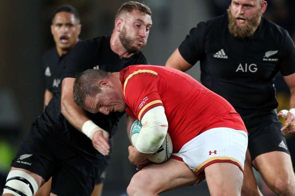 New Zealand’s Luke Romano tussles with Wales' Gethin Jenkins. Photos: AFP