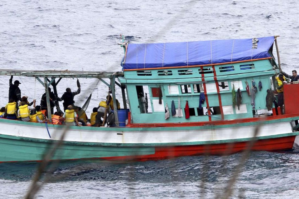 A fishing boat carrying Vietnamese asylum seekers nears the shore of Australia's Christmas Island in April 2013. Photo: AP