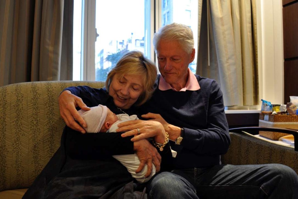 US Democratic presidential candidate Hillary Clinton and former president Bill Clinton are seen with their second grandchild, Aidan Clinton Mezvinsky, born on Saturday to Chelsea Clinton and her husband Marc Mezvinsky. Photo: Reuters