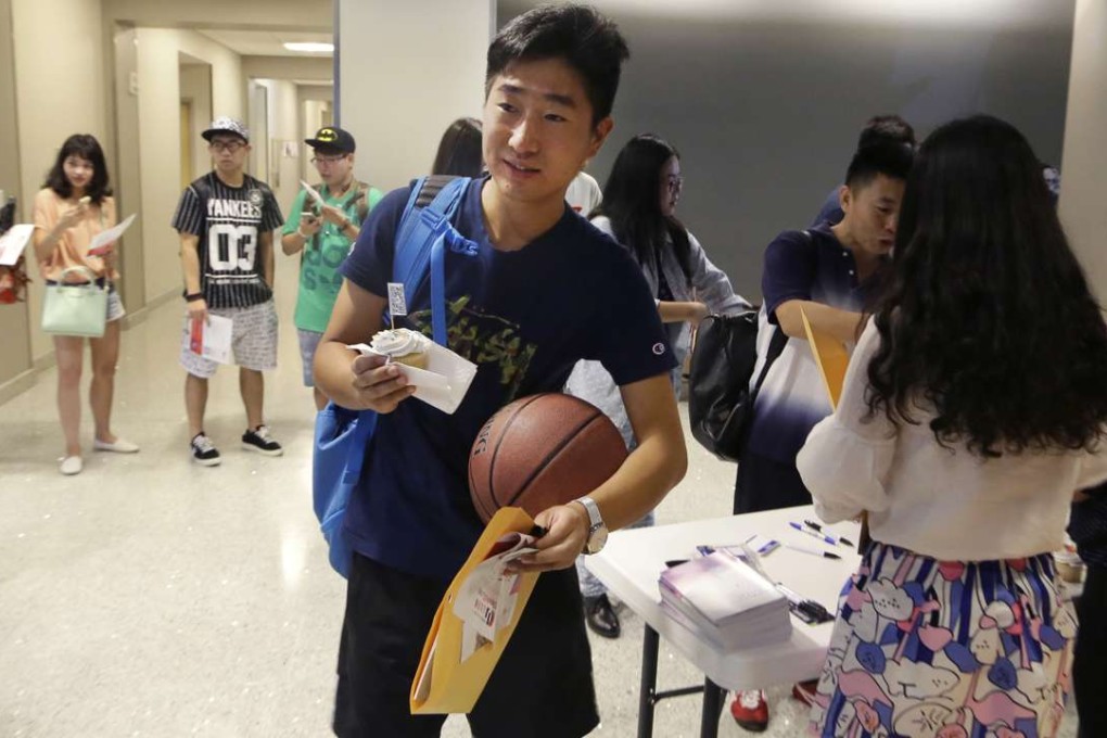 Nie Weikang, a finance graduate student from China, walks into an orientation for Chinese students at the University of Texas at Dallas in Richardson, Texas. The US Census Bureau research shows immigrants from China have overtaken Mexicans as the largest group coming into the US. Photo: AP