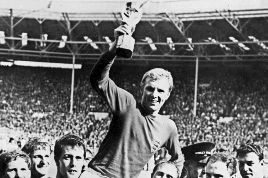 Bobby Moore holds aloft the Jules Rimet trophy as he is carried by his team mates following England's victory over Germany in the 1966 World Cup final. Photos: AFP