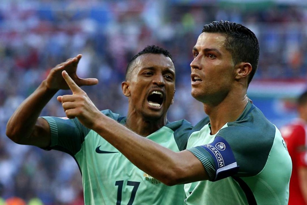 Cristiano Ronaldo of Portugal (R) celebrates scoring with Nani EPA