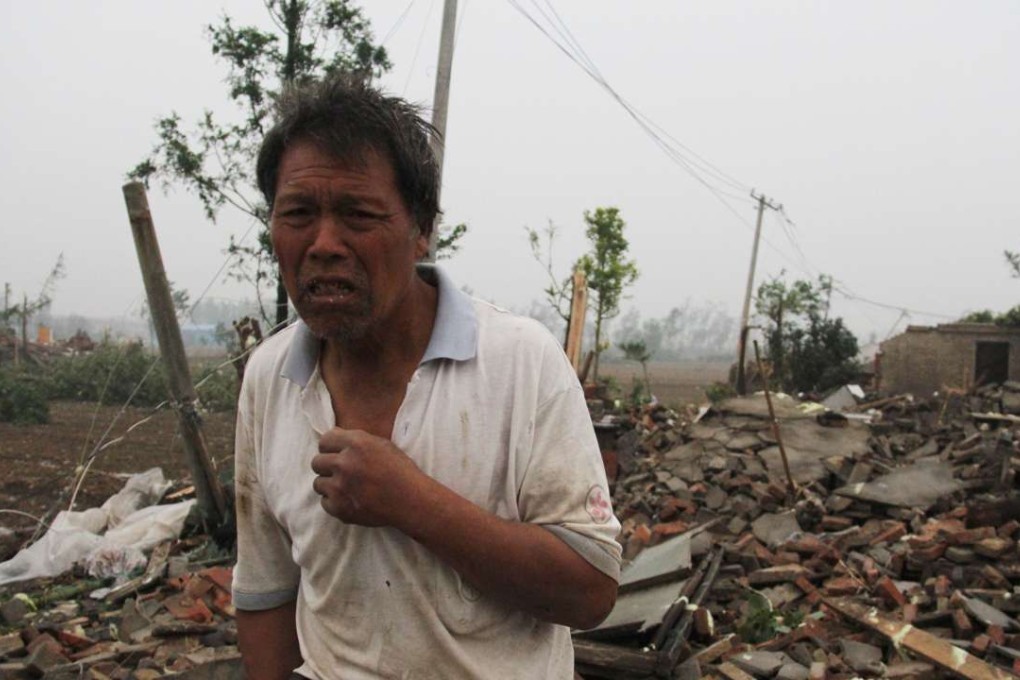 A man walks through the rubble of destroyed houses after a tornado struck in Funing county in Yancheng, Jiangsu province. Photo: AFP