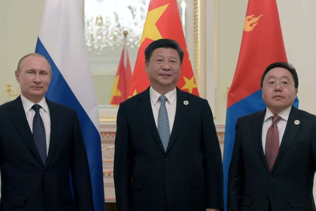 Russian President Vladimir Putin (left), China's President Xi Jinping (centre) and Mongolian President Tsakhiagiin Elbegdorj are pictured in Tashkent on Thursday. Photo: AFP