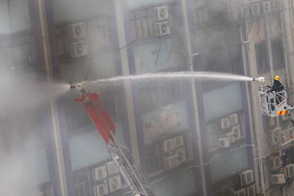 Firemen fight the blaze in Cheung Sha Wan in March 2010. Photo: David Wong