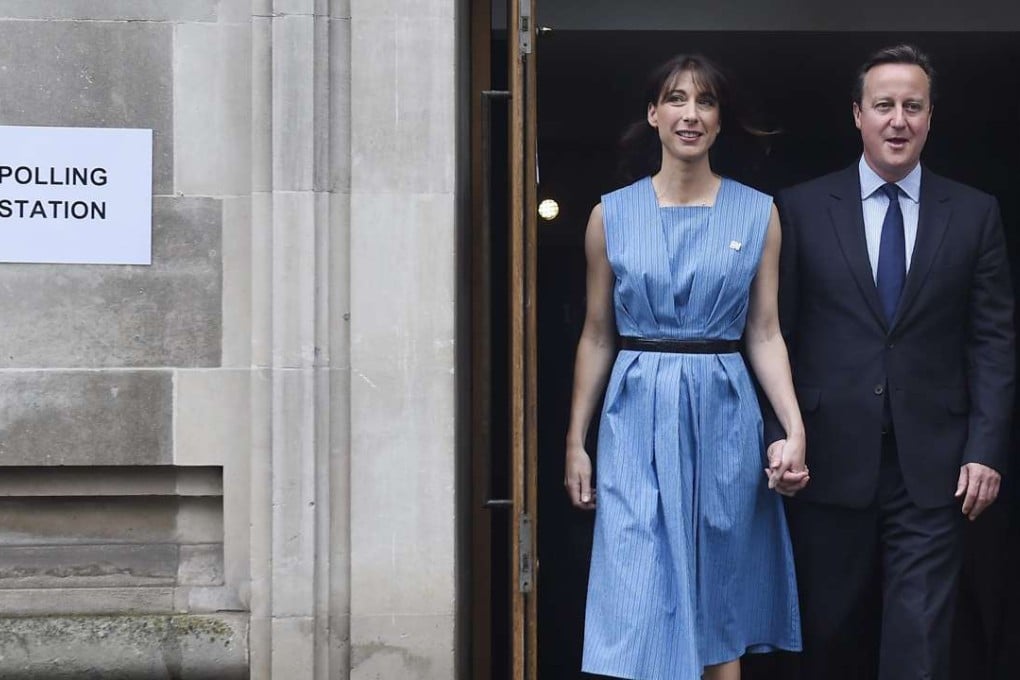 British Prime Minister David Cameron and his wife Samantha leave the Central Methodist Hall in London after casting their votes. Photo: EPA