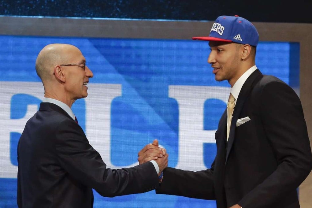 NBA commissioner Adam Silver greets Ben Simmons after announcing him as the top pick by the Philadelphia 76ers. Photo: AP