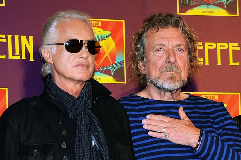 FILE - In this Oct. 9, 2012 file photo, Led Zeppelin guitarist Jimmy Page, left, and singer Robert Plant appear at a press conference ahead of the worldwide theatrical release of "Celebration Day," a concert film of their 2007 London O2 arena reunion show, in New York. Led Zeppelin's lawyers asked a judge Monday, June 20, 2016, to throw out a case accusing the band's songwriters of ripping off a riff for "Stairway to Heaven." (Photo by Evan Agostini/Invision/AP, File)
