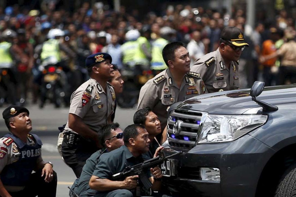Police officers react near the site of an attack in Jakarta in January, which was claimed by Islamic State. Photo: Reuters