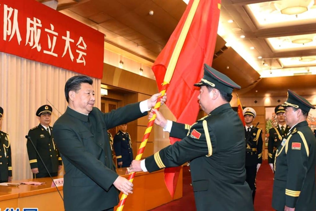 President Xi Jinping hands a military flag to General Li Zuocheng in January. Photo: Xinhua