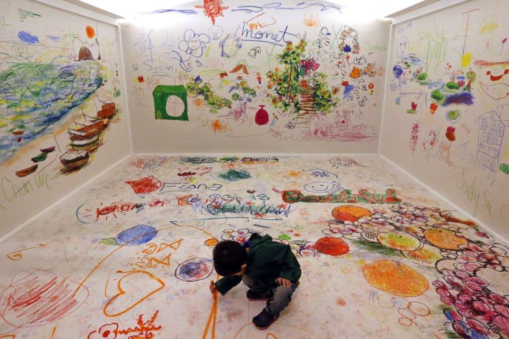 A child enjoys himself at the Claude Monet exhibition at Hong Kong Heritage Museum in Sha Tin. It’s natural and noble for parents to want to give their children the best chance possible in life. Photo: Felix Wong