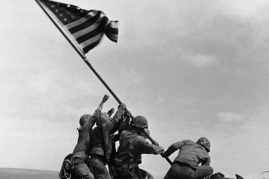 The classic image shows six marines erect a US flag on the Japanese island of Iwo Jima in February 1945. Photo: AP