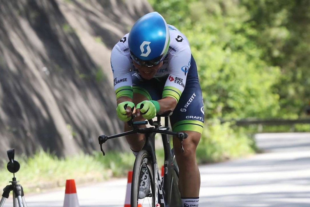 Cheung King-lok crosses the line in the men’s 15km time trial at the Hong Kong Cycling Championships at Bride Pool Road, Tai Po. Photos: Edward Wong