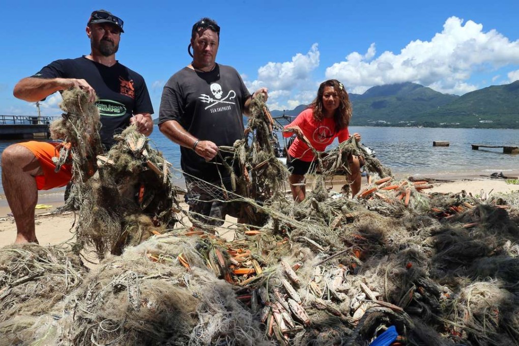 Showing their sea haul near Pui O, Lantau Island, are (from left) lain Brymer, Gary Stokes and Adrienne Ng. Photo: K. Y. Cheng