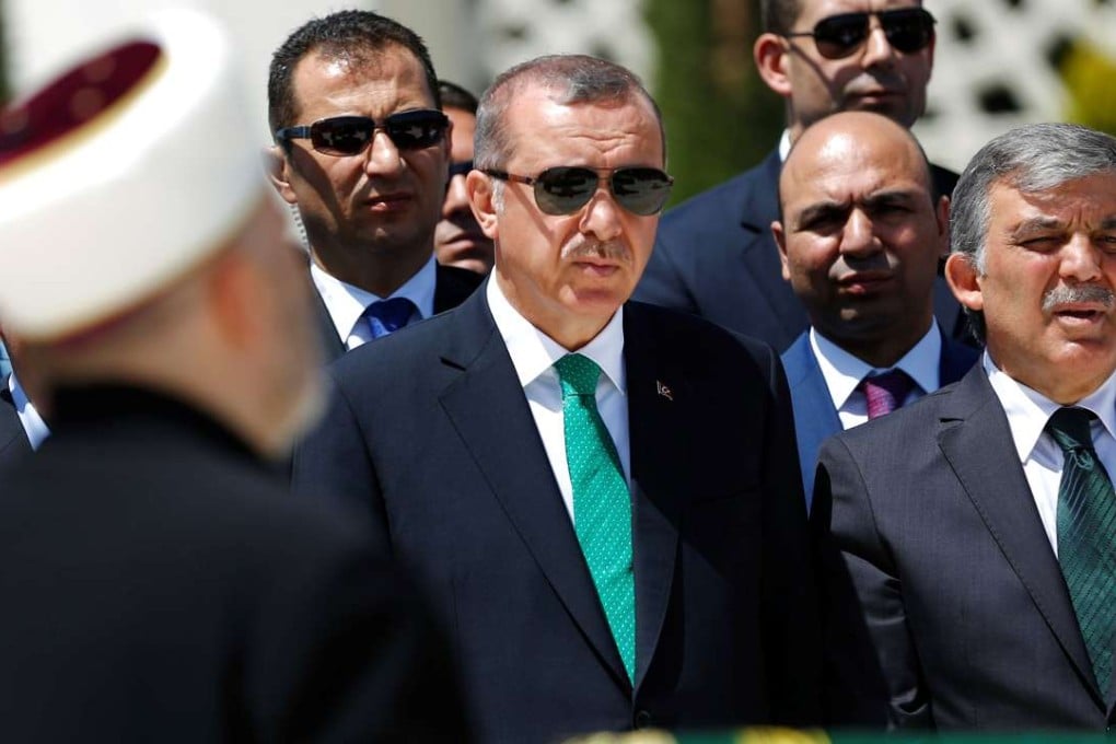 Turkish President Tayyip Erdogan (centre) and former president Abdullah Gul (right) at funeral in Istanbul. Photo: Reuters