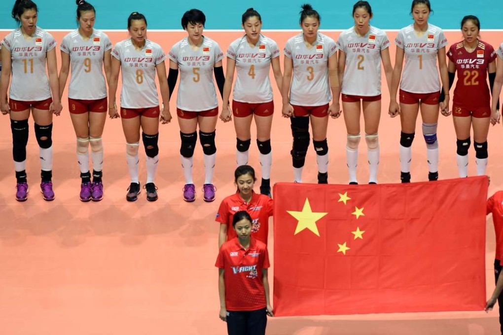 China players wait as the national anthem is played before their match against Germany. Photos: Xinhua