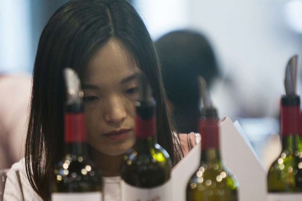 A Chinese buyer of fine wine attends Vinexpo in Hong Kong in May. Photo: EPA