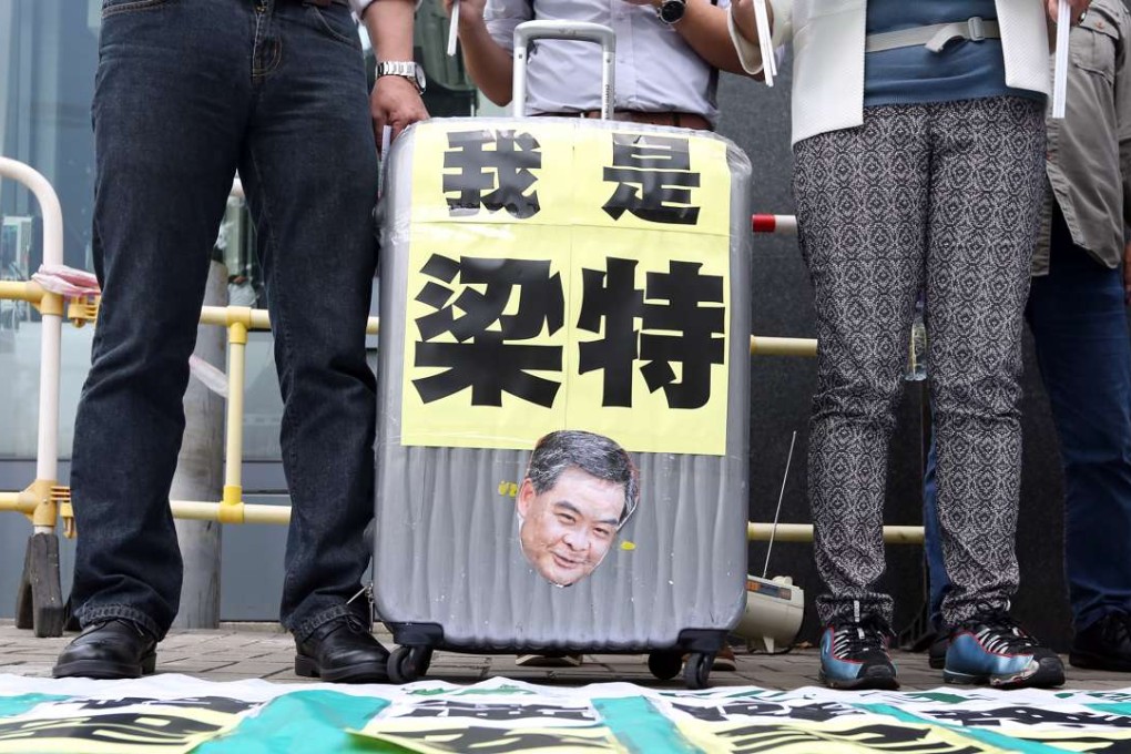 Members of Democratic Party staged a protest outside the Central Government Office in April against CY Leung allegedly pressuring airport staff in bag row . Photo: Nora Tam