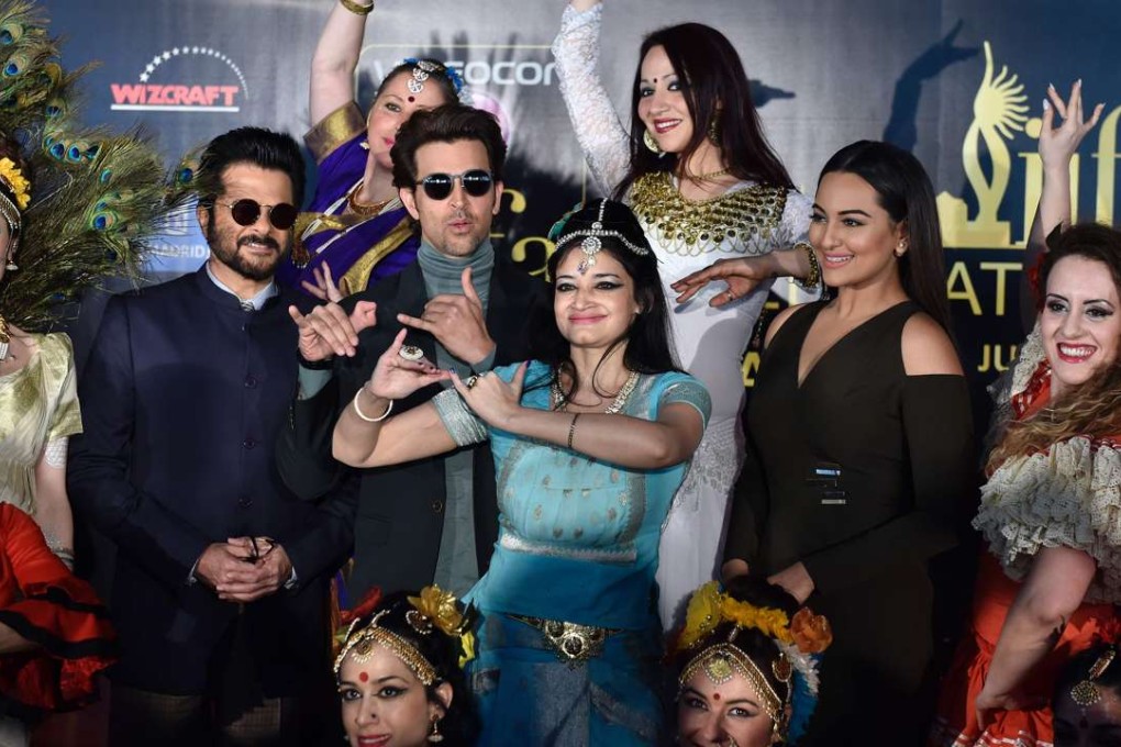 Indian actors pose with dancers before the ‘Bollywood Oscars’ in Madrid. Photo: AFP