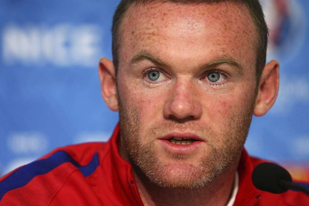 England's Wayne Rooney speaks during a press conference EPA