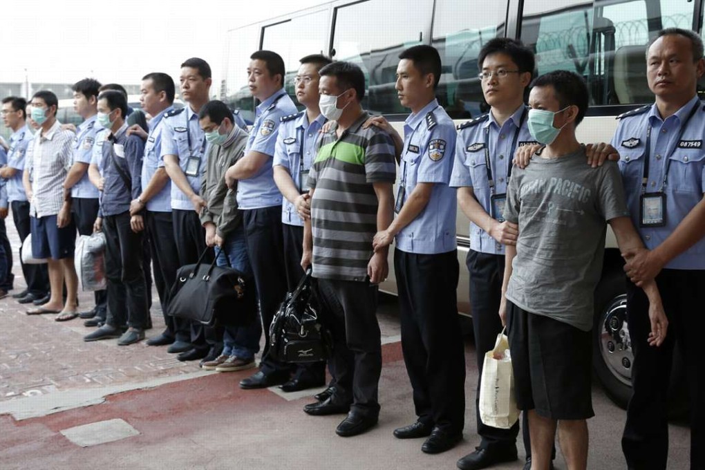 Six fugitives reportedly involved in economic crimes arrive back in Beijing from Indonesia as part of China’s ‘Fox Hunt’ campaign in June 2015. Photo: Xinhua